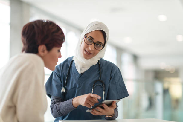 istock Muslim surgeon consults female patient 1160659292