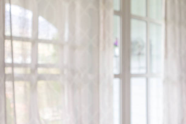 istock window curtain with green garden abstract blur background 1160659371