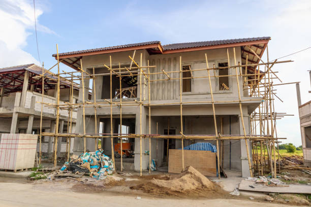 istock construction residential new house in progress at building site with clouds and blue sky 1160659445