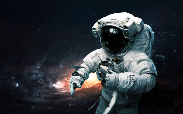 astronaut against galaxy. science fiction art. elements of this image furnished by nasa - exploration sky deep blue imagens e fotografias de stock