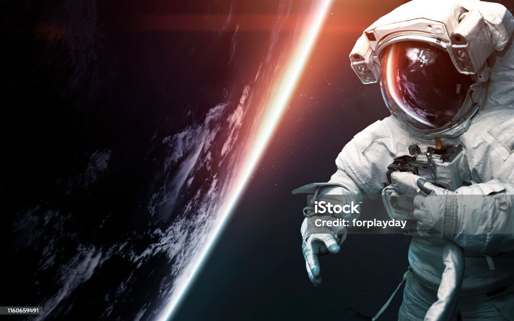Astronaut at spacewalk. Science fiction art. Elements of this image furnished by NASA Astronaut Stock Photo