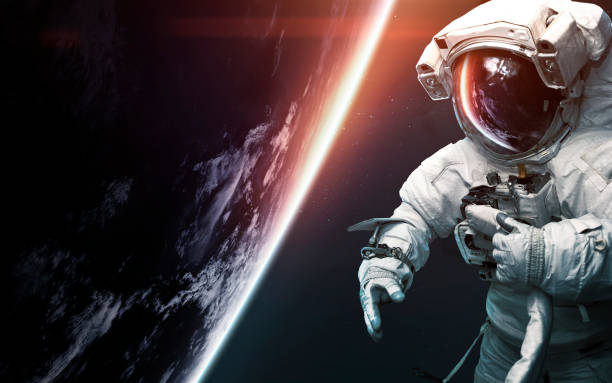 Astronaut at spacewalk. Science fiction art. Elements of this image furnished by NASA Astronaut at spacewalk. Science fiction art. Elements of this image furnished by NASA astronaut stock pictures, royalty-free photos & images