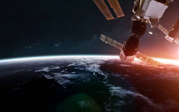 istock International space station orbiting Earth planet. Science fiction art. Elements of this image furnished by NASA 1160659498