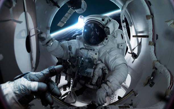 istock Astronaut at the international space station orbiting Earth planet. Elements of this image furnished by NASA 1160659503