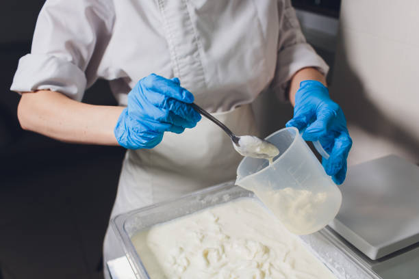 istock Traditional Cheese Making In A Small Company. Cheese Maker Hands Close-up Top View. 1160660514