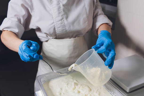istock Traditional Cheese Making In A Small Company. Cheese Maker Hands Close-up Top View. 1160660517