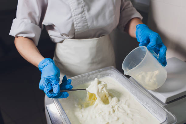 istock Traditional Cheese Making In A Small Company. Cheese Maker Hands Close-up Top View. 1160660522