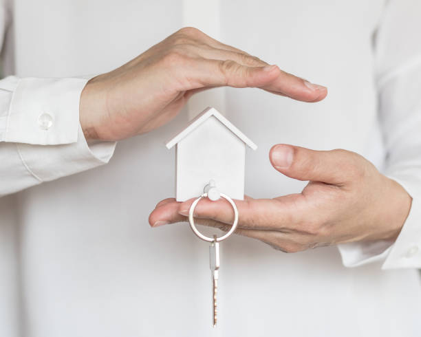 istock House key in home Insurance agent's hand protection 1160660888