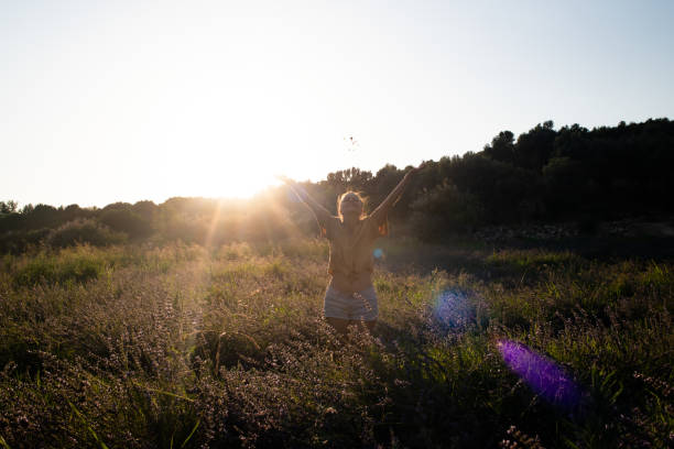istock Arms out in lavender field 1160663757