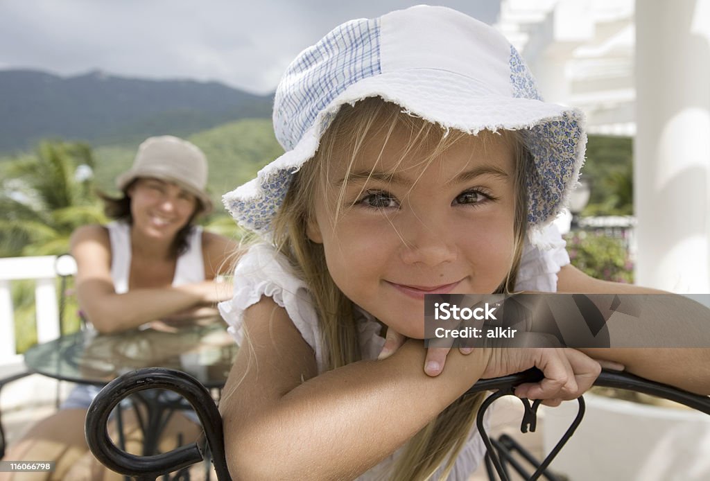 Portrait of mother Portrait of mother and daughter sitting at the table Adult Stock Photo