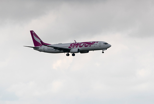 A Swoop Airlines Boeing 737, with identification C-FLBV, landing at Edmonton International Airport on July 7, 2019