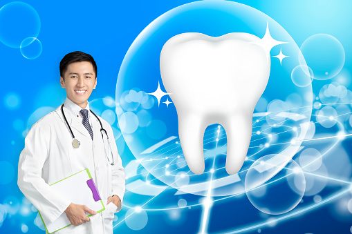 young dentist doctor showing Healthy tooth with glowing concept
