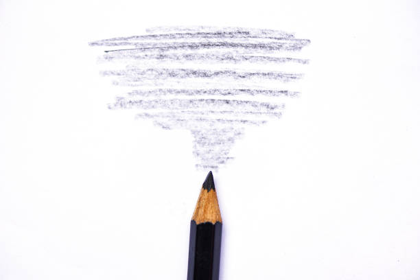 istock wooden crayon texture with cyan black drawings on white paper 1160671082