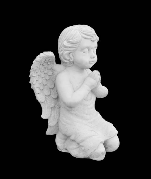 istock Cupid sculpture isolated on black background 1160676250