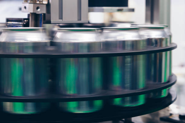 istock empty new aluminum cans for drink process are moving in factory line on conveyor belt machine at beverage manufacturing. food and beverage industry business concept. 1160679695