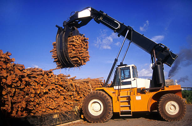 industrial machine carrying logs