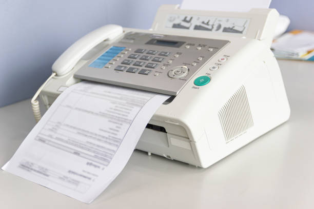 The fax machine for Sending documents in the office stock photo