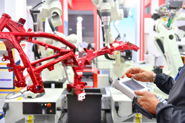 Engineer check and control automation Robot arm machine for Automotive stock photo