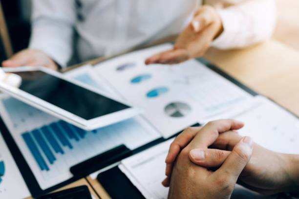 istock Managers are using tablet and explain the summary report to employee in office room. 1160687078