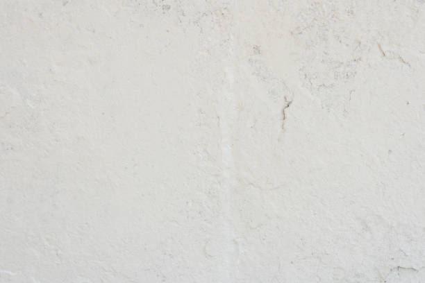 istock Texture of a concrete wall with cracks and scratches which can be used as a background 1160687895