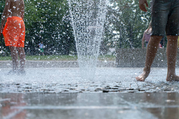 istock Barefoot person running through a fountain 1160688000