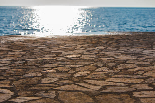 travel concept concrete beach with copy space. sunset