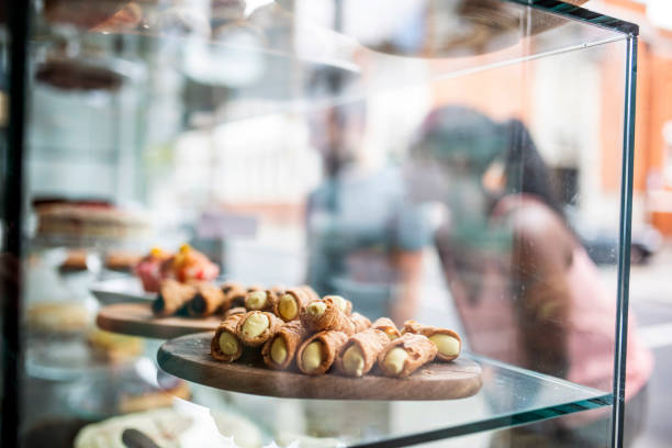 Couple exploring pastry in a local bakery in London