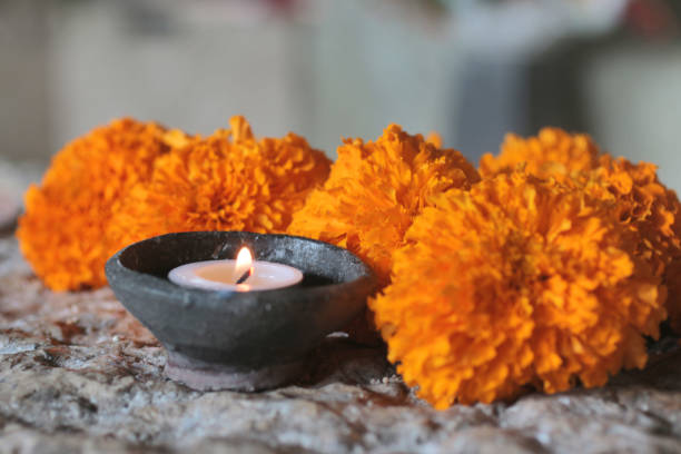 istock Spa candle light and orange marigold flowers arrangement. 1160694163