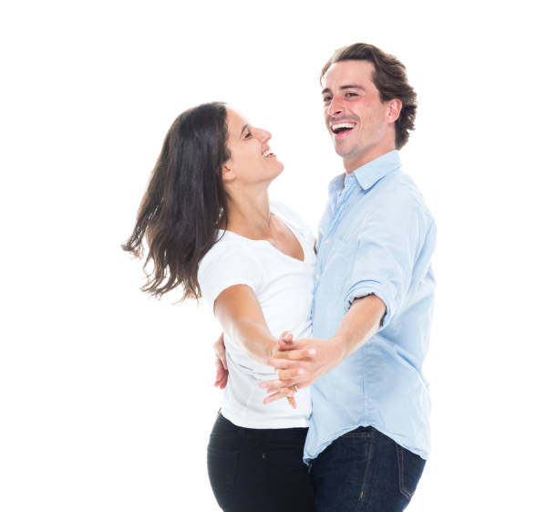 istock Attractive couple are happily dancing 1160695784
