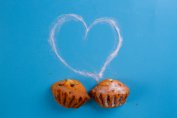 muffin on the blue background with sugar