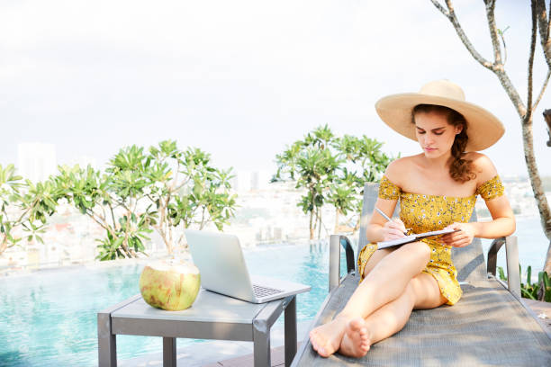 istock Businesswoman working at swimming pool 1160697544