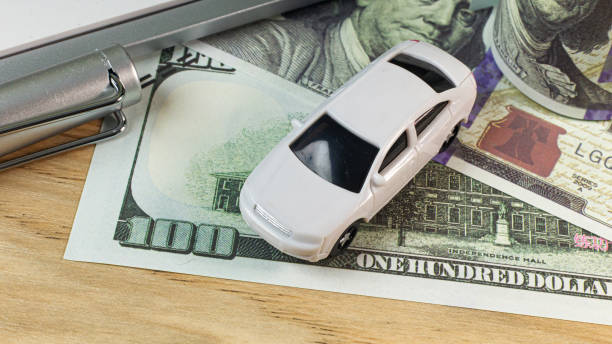 istock white  toy car  on work station table in office. 1160697756