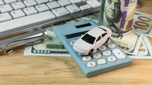 istock white  toy car  on work station table in office. 1160697882