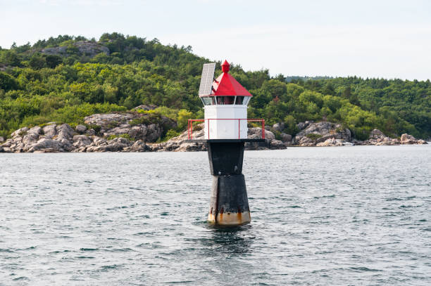istock Solar powered navigational light by an island. 1160698760