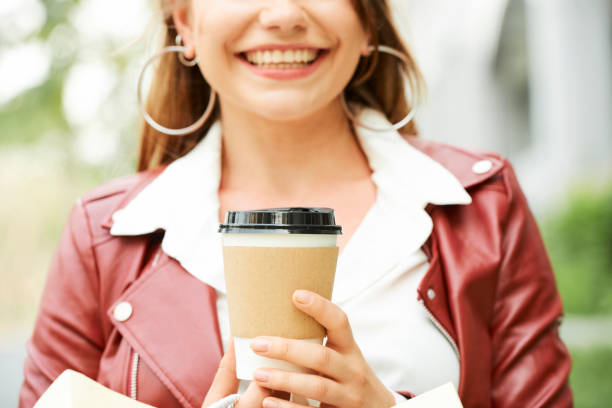 istock Cheerful woman with coffee cup 1160699066
