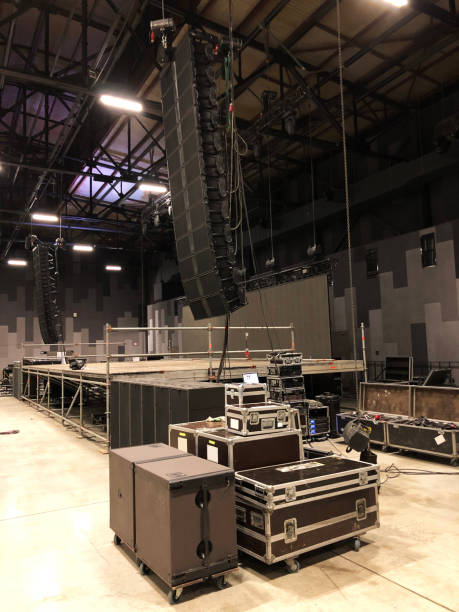 istock Installation of professional sound speakers, line array, light, video and stage equipment for a concert. 1160702451