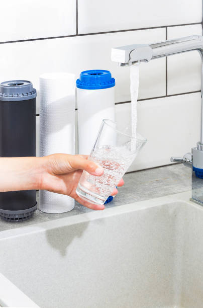 istock The tap from which water flows. Quenching thirst. Water problems in some countries.The glass is filled with water. 1160702479