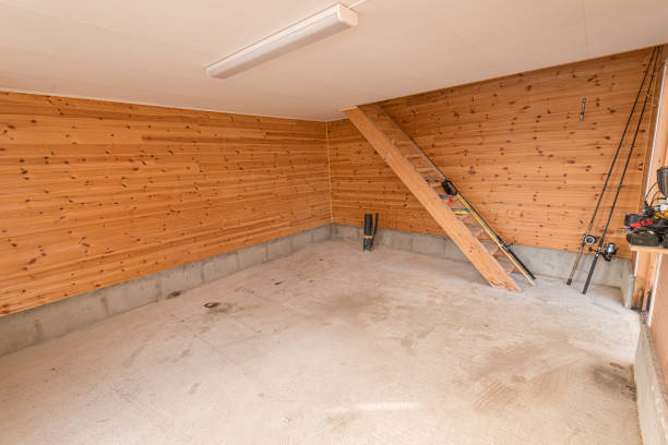 istock Almost empty room with wooden walls and stairs. 1160703341