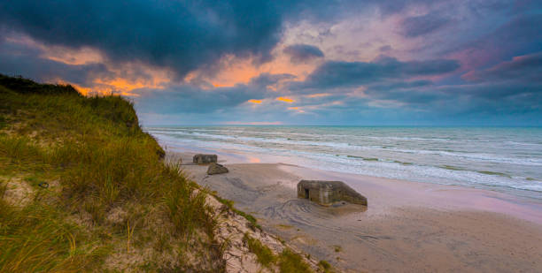 istock Long exposure of old bunker fortifications on a sandy beach. 1160703370