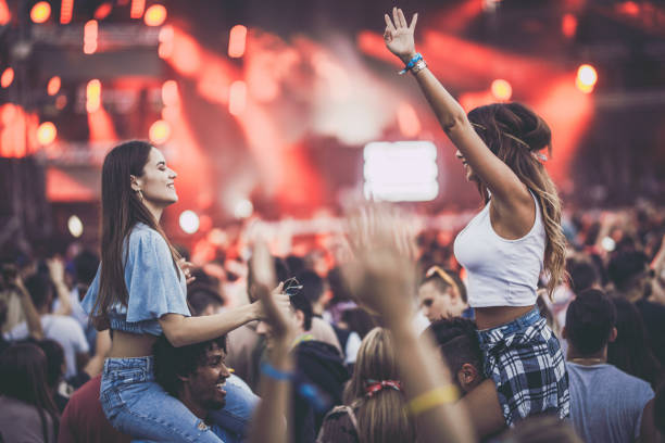 istock Young carefree couples having fun on a music concert. 1160703627