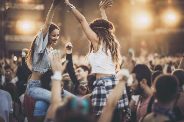 istock Young happy couples having fun on a music festival. 1160703655