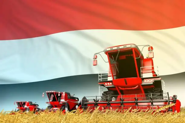 Photo of red grain agricultural combine harvester on field with Yemen flag background, food industry concept - industrial 3D illustration