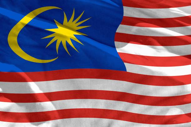 istock Waving Malaysia flag for using as texture or background, the flag is fluttering on the wind 1160704951