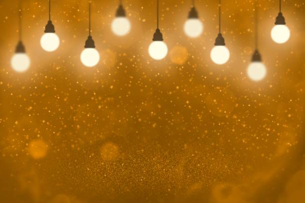 istock orange wonderful shining glitter lights defocused light bulbs bokeh abstract background with sparks fly, festal mockup texture with blank space for your content 1160705544