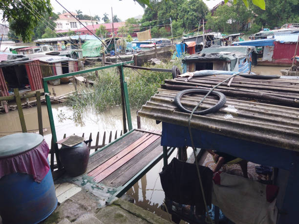 istock Foggy river with houseboats 1160705572