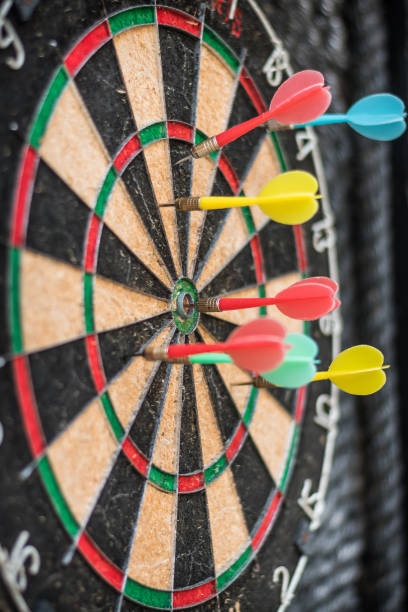 istock Target dart game with one win arrow hit on middle point spot and many missing for competitive business marketing concept 1160705669