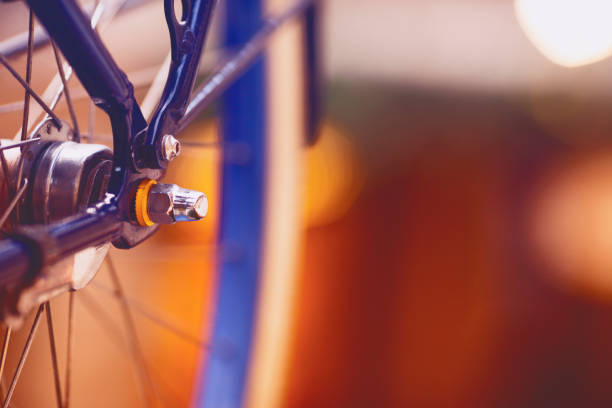 istock Bicycle wheel closeup. Blurred background. Space for a text. 1160707088