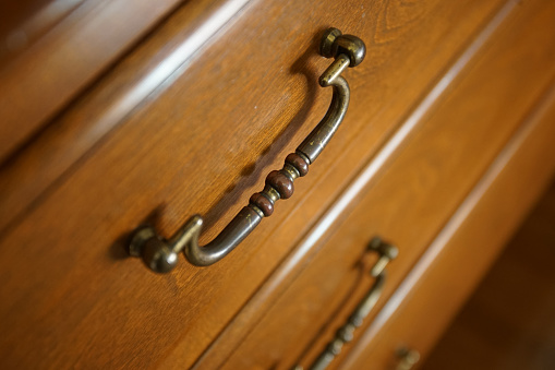 Wooden chest and handle of the room