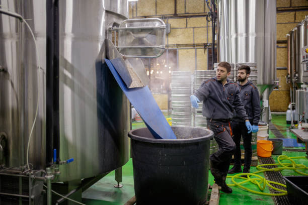 istock Brewer working on machinery at brewery 1160710452