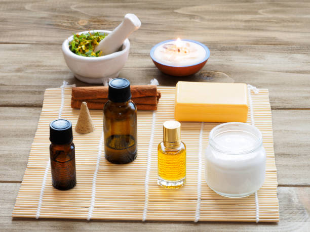 istock Natural aromatherapy and spa ingredients on a brown wooden background 1160713374